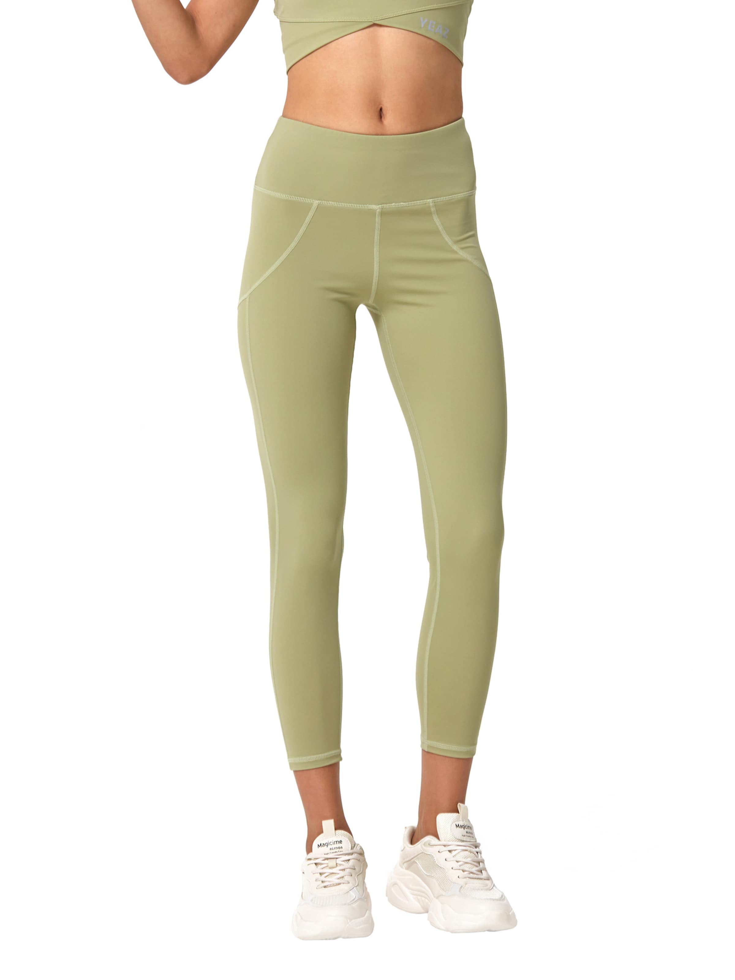 Slimfit Leggings 'Classy' de la YEAZ pe verde: față