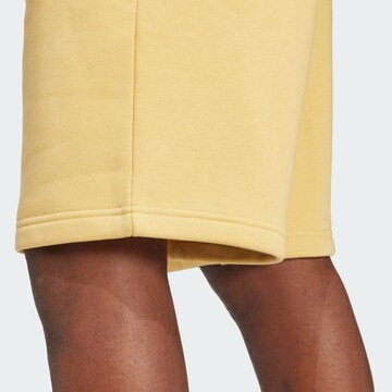 ADIDAS ORIGINALS Normalny krój Spodnie 'Trefoil Essentials' w kolorze żółty
