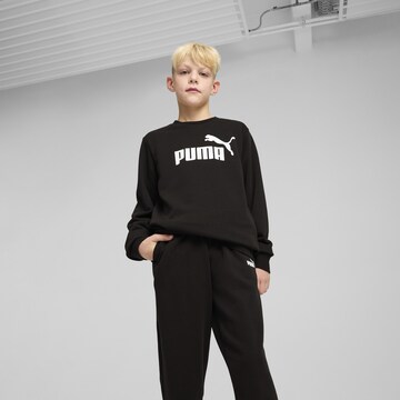 PUMA Joggingpak 'Essentials' in Zwart