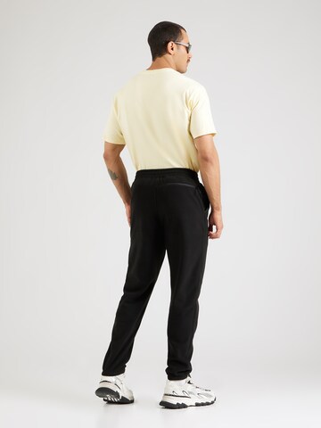 THE NORTH FACE - Tapered Calças de desporto 'GLACIER' em preto