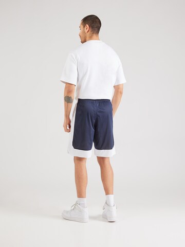 Champion Authentic Athletic Apparel Loosefit Kalhoty – modrá