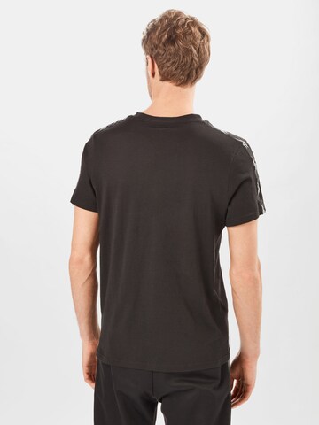 Reebok - Camiseta funcional en negro