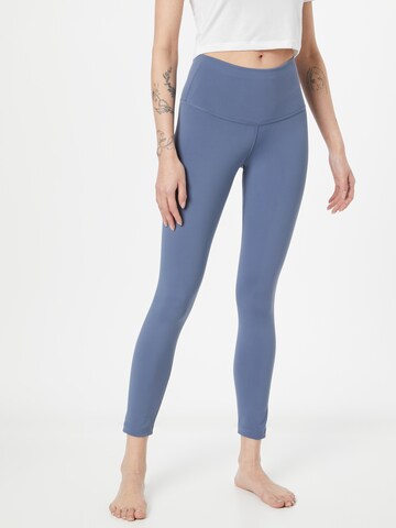 NIKE Skinny Workout Pants in Blue: front