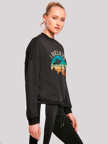 Sweat-shirt 'I Believe UFO Alien Sonnenuntergang' F4NT4STIC en noir