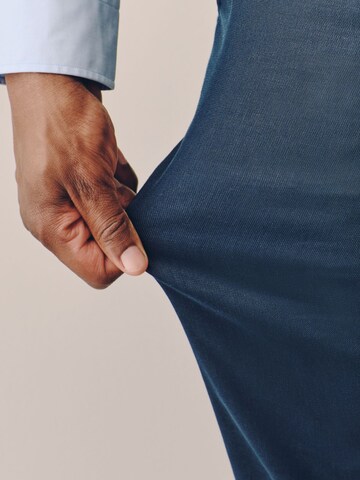 Next Slim fit Trousers with creases 'Motionflex' in Blue