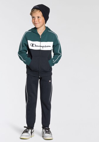 Champion Authentic Athletic Apparel Tracksuit in Blue: front