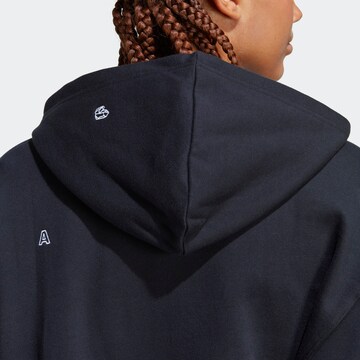 ADIDAS SPORTSWEAR Urheilullinen collegepaita 'Relaxed With Healing Crystals-Inspired Graphics' värissä musta