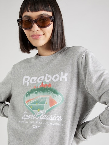 Reebok - Sweatshirt de desporto em cinzento