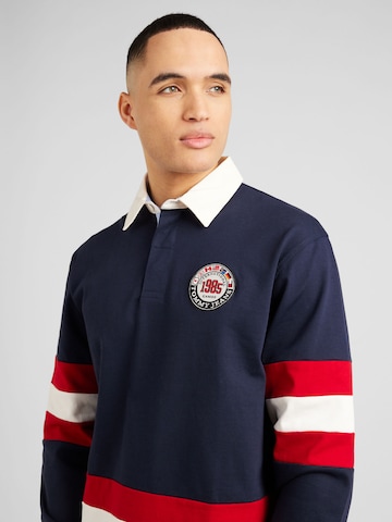 Tommy Jeans Poloshirt 'ARCHIVE GAMES' in Blau