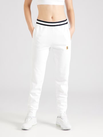 NIKE Tapered Workout Pants in White: front