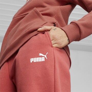 Effilé Pantalon de sport 'Essentials' PUMA en rouge