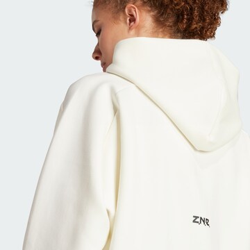 ADIDAS SPORTSWEAR Спортна жилетка с качулка 'W Z.N.E. FZ' в бяло