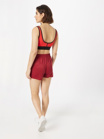 PUMA Regular Sportbroek 'SHE MOVES THE GAME' in Rood