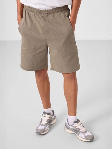 Tommy Life - Loosefit Calças em verde: frente