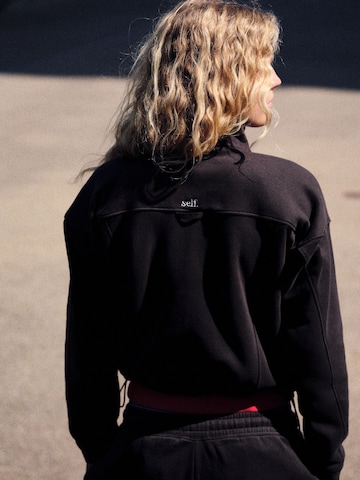 self. - Sudadera en marrón