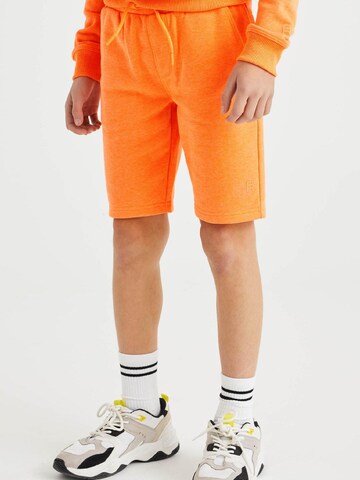 WE Fashion - Slimfit Calças em laranja: frente