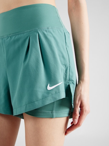 NIKE Regular Sports trousers in Green