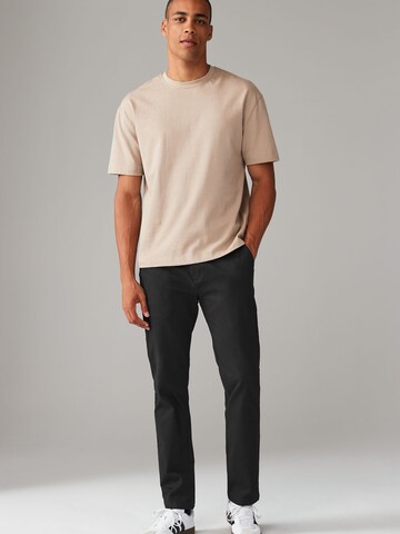 Slimfit Pantaloni chino di Next in nero