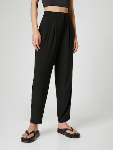 Guido Maria Kretschmer Women Loose fit Pleat-front trousers 'Mila' in Black: front