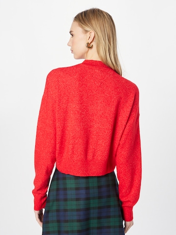 Pull-over Tommy Jeans en rouge