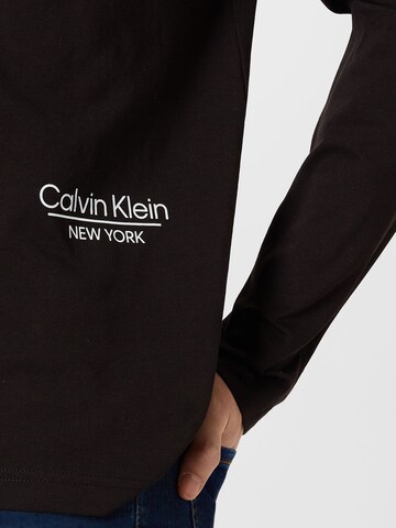 Calvin Klein قميص بلون أسود