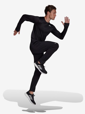 ADIDAS SPORTSWEAR Normalny krój Spodnie sportowe 'Own The Run Soft Shell' w kolorze czarny