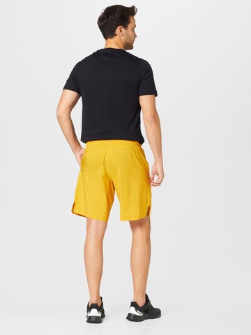 Reebok Regular Sports trousers in Yellow