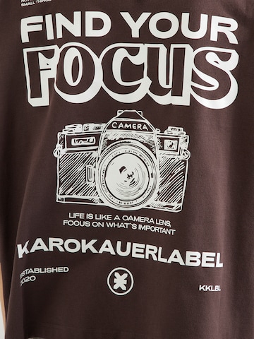 Karo Kauer T-Shirt in Braun