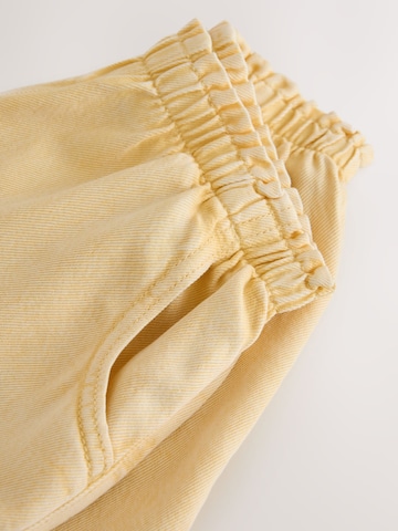 Next - Loosefit Pantalón en amarillo