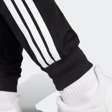 Tapered Pantaloni sport de la ADIDAS SPORTSWEAR pe negru