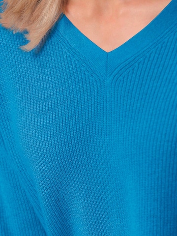 Goldner Pullover in Blau