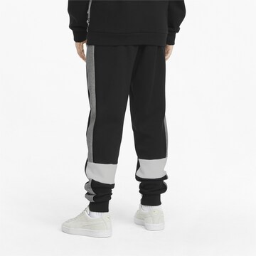 PUMA Tapered Sporthose 'Essential+' in Schwarz