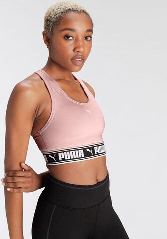 Bustino Reggiseno sportivo di PUMA in rosa