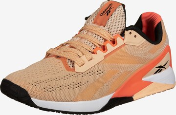 Scarpa sportiva 'Nano X1' di Reebok in arancione: frontale