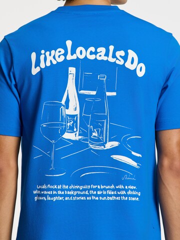 Shiwi Тениска 'Liam Like Locals Do' в синьо