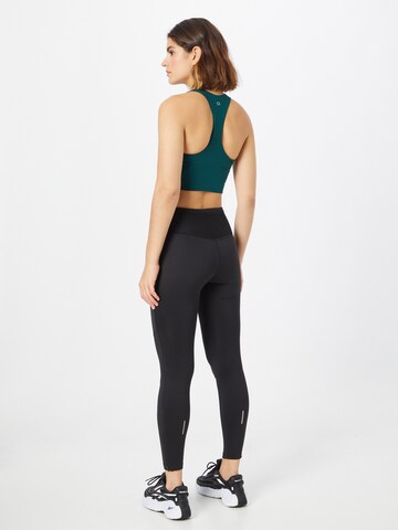 Skinny Pantaloni sport de la ASICS pe negru