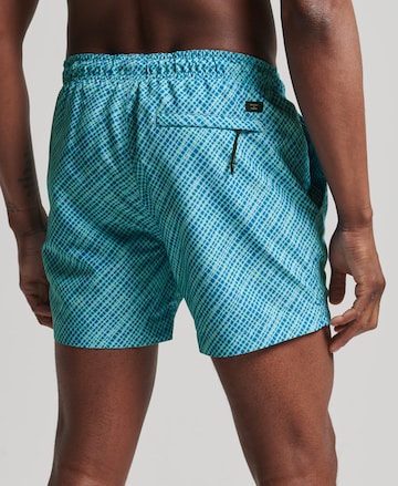 Superdry Badeshorts 'Studios' i blå