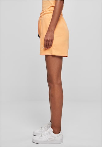 Karl Kani Regular Trousers in Orange