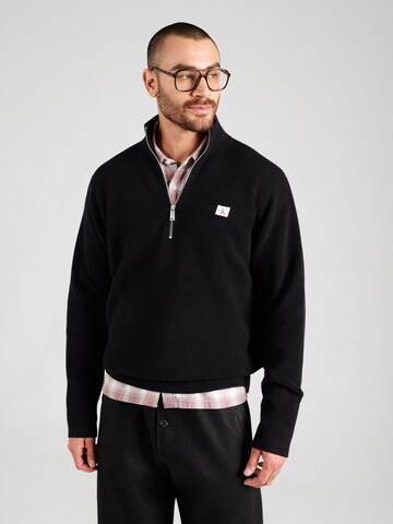 Pull-over Calvin Klein Jeans en noir : devant