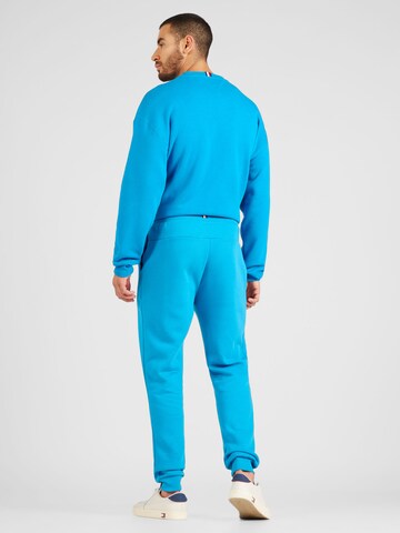 TOMMY HILFIGER Zúžený Kalhoty 'GRAPHIC' – modrá