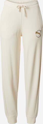 PUMA Tapered Sports trousers in Beige: front