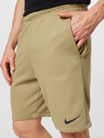 NIKE Regular Workout Pants in Green