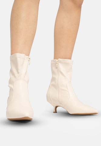 Salinyang Ankle Boots in Beige: front
