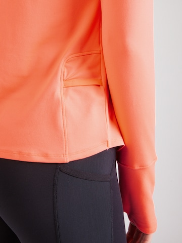 Maglia funzionale 'Qualifier Run' di UNDER ARMOUR in arancione