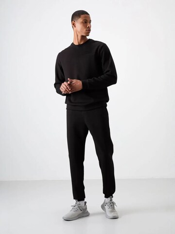 Tommy Life Trainingspak 'Aktive Sets' in Zwart: voorkant