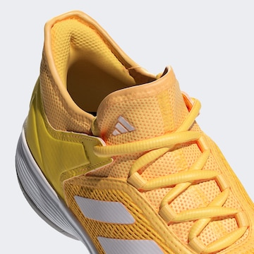 Chaussure de sport 'Ubersonic 4' ADIDAS PERFORMANCE en jaune