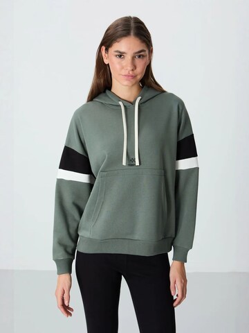 Sweat-shirt Tommy Life en vert : devant