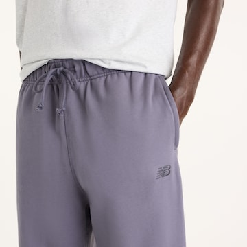 Loosefit Pantaloni 'Athletics French Terry Jogger' di new balance in lilla