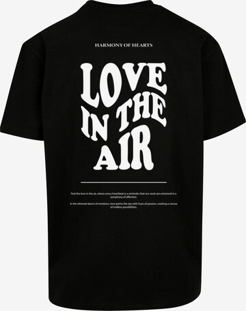 Merchcode T-Shirt 'Love In The Air' in Schwarz