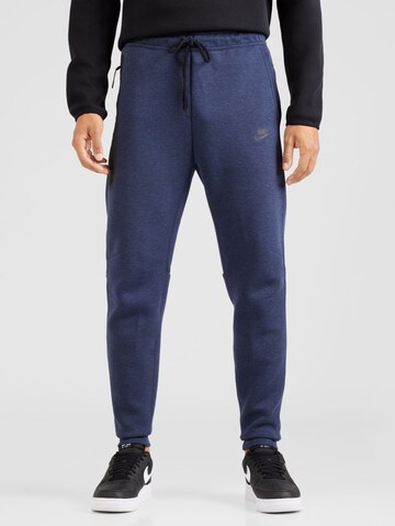 Nike Sportswear Tapered Broek 'TECH FLEECE' in Blauw: voorkant